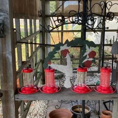 Cast iron hummingbird bells, Welcome sign and hummingbird feeders