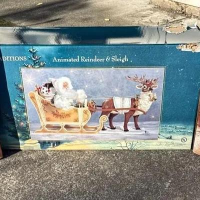 Animated Reindeer And Sleigh And Two Novelty Santa Statues
