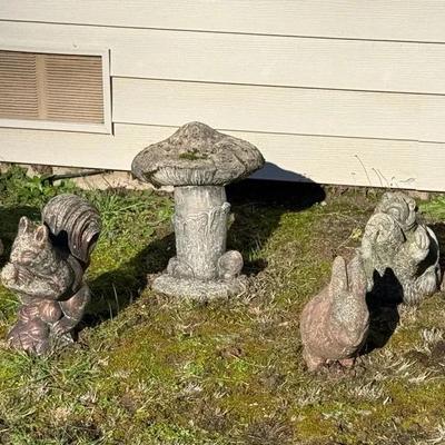 Seven Small Concrete Yard Statues