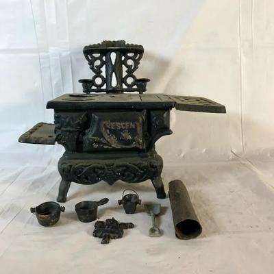 Antique Crescent Cast Iron Toy Stove with Accessories