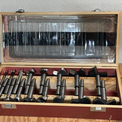 15-piece Forstner drill bit set in a wooden storage cas