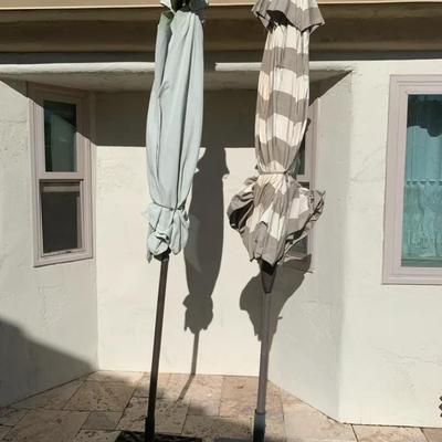 Two Patio Umbrellas With Stands