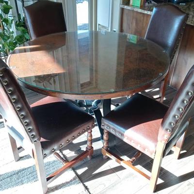 Large Round Copper Dining Table With Four-Faux Leather Nailhead Trim Chairs