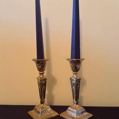 A pair Of Ornate Brass Candlesticks With Square Base