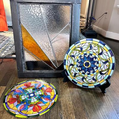 Two Pieces Of Glass Art, And One Piece Of Framed Stained Glass Art