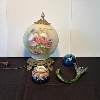 Victorian-style "Gone with the Wind" lamp, a glass paperweight, and a small decorative jar.  