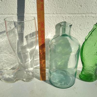 Three pieces of glassware including a glass boot