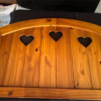 Country-Style Pine Daybed With Heart Cutouts.