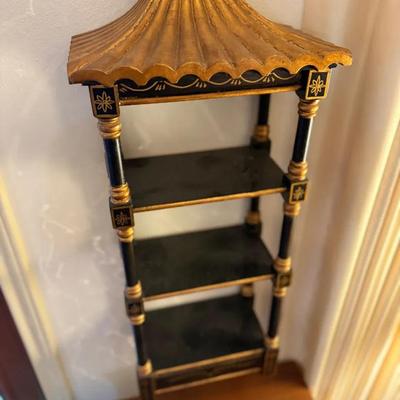 Black and gold wall shelf