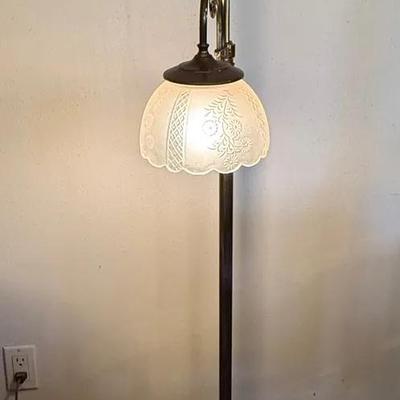 vintage bridge arm floor lamp with a frosted glass shade