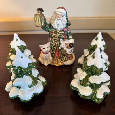 This is a ceramic Christmas figurine set 