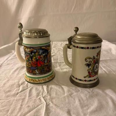 2 Vintage German Beer Steins – Tavern Scene & Heraldic Crest
