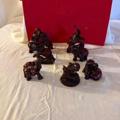 Red Resin Elephant Figurines – Matching Decorative Set (7 Pieces)