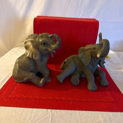 Pair of Realistic Resin Elephant Figurines with Raised Trunks