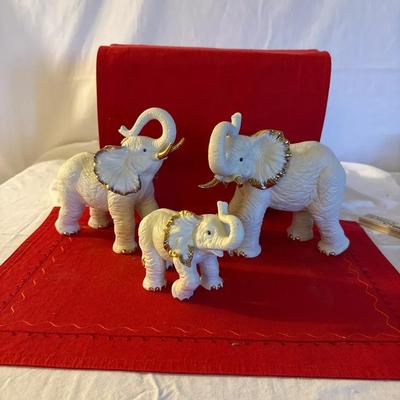 Set of Three White Porcelain Elephant Figurines with Gilt Accents”