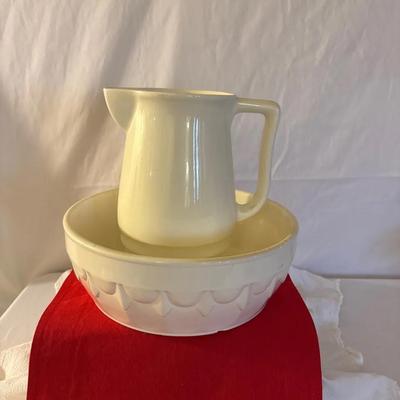 This is a vintage ceramic pitcher and bowl (wash basin) set, commonly referred to as a washstand set