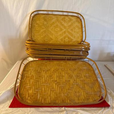 This is a set of vintage mid-century modern woven rattan and bamboo serving trays
