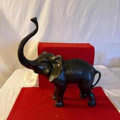 Black Metal Elephant Figurine with Raised Trunk and Brass Accents