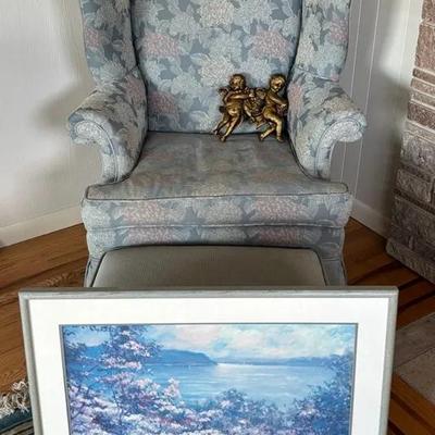 Light Blue Wingback Chair W/ Footrest, Angel Statues & Painting
