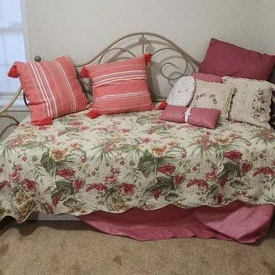 Daybed with Flowery Linens and Throw Pillows
