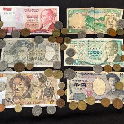 Collection Of Coins And Folded Bills 