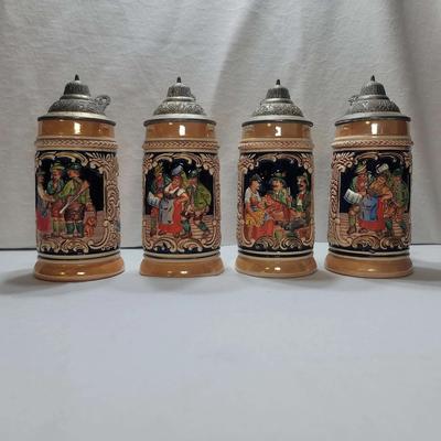 Vintage German "Ein volles Glas des Gastes Spaß" Lusterware And Pewter Steins