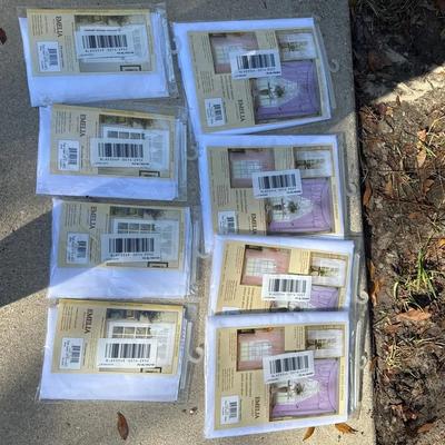 Set of eight sheer curtain panels new in package