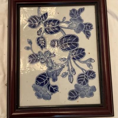 Decorative wall cross and a framed tile