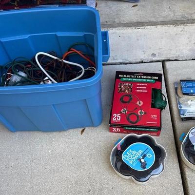 Tub of electrical extension, cords, and outlets