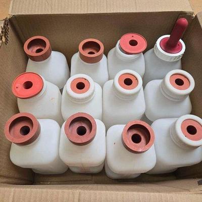 5554 • (12) calf feeding bottles