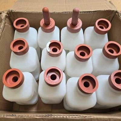 5556 • (12) calf feeding bottles