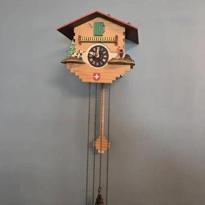 Vintage Hand-Carved Wooden Cuckoo Clock in the traditional chalet style