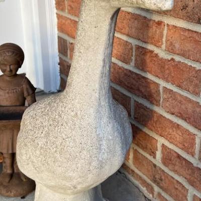 Cement duck with multiple outfits