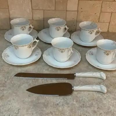 Tea Cups And Saucers And Cake Servers