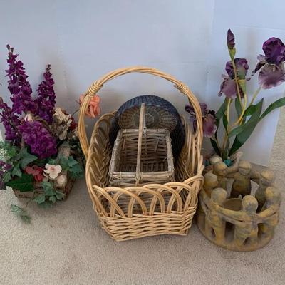Baskets, Faux Flowers, And A Terracotta Circle Of Friends Candle Holder