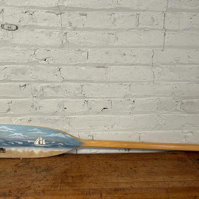 A Lighthouse And Beach Scene Painted Wooden Oar