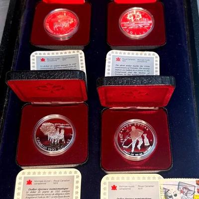 Four rcm silver dollars 1992 1993, 1984 and 1985