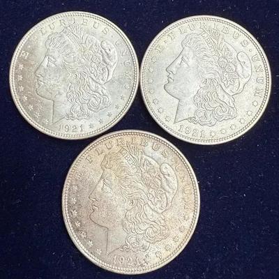 Three 1921 morgan silver dollars