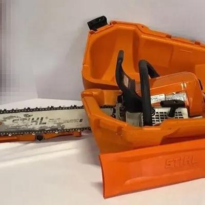 Stihl chainsaw MS 250 In An Orange Stihl Woodsman Saw Case