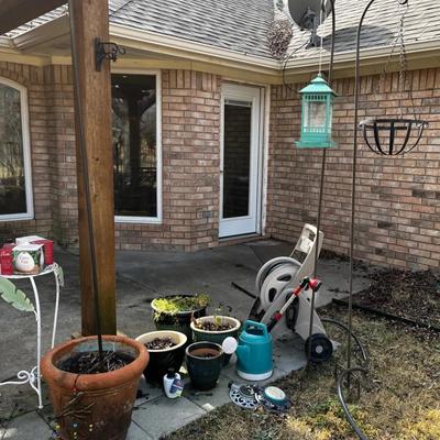 Ceramic flower pots plus shepard’s hooks and other patio goods