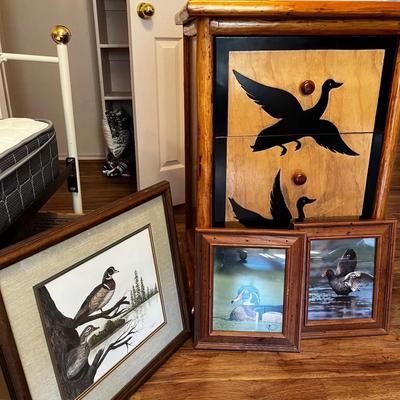 Rustic storage cabinet and framed duck art