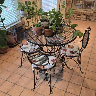 Sale Photo Thumbnail #107: Vintage Black Wrought Iron Mesh Scroll Patio Set with a Round Table and Four Chairs