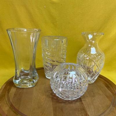 A collection of four decorative cut crystal glass items