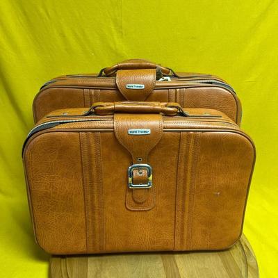 Vintage World Traveler faux leather suitcase with buckle closure