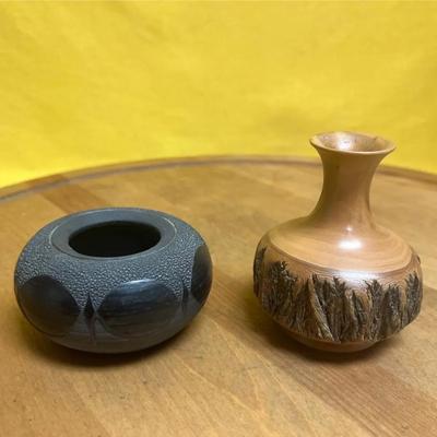 A studio pottery bowl marked "AM 95" and a wooden vase marked "red bottle brush R.H.S."