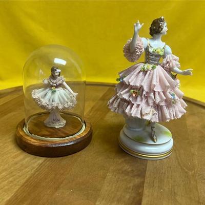 Pair of Dresden lace porcelain figurines of ladies in elaborate dresses