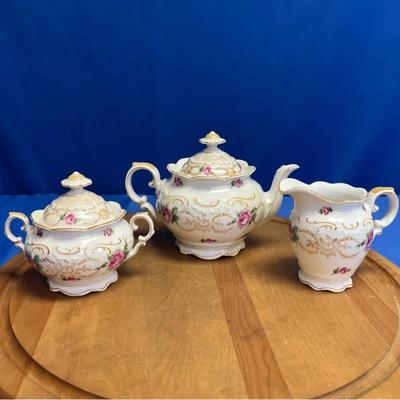 A vintage Schumann Bavaria porcelain tea set with roses and gold trim