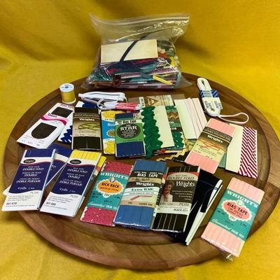 A collection of vintage bias tape, seam binding, and sewing notions
