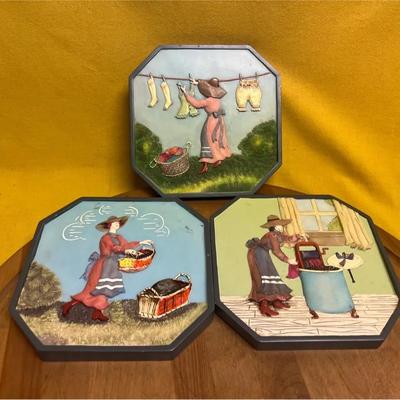 Set of three mid-century chalkware wall plaques depicting domestic scenes