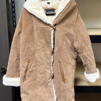 A vintage Cooper suede jacket with faux shearling lining and toggle closures